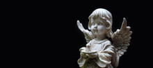 Old Statue Of Angel Baby With Candle On Abstract Black Background. Concept Of Faith, Christianity, Memory, Religion. Background For Condolence, Mourning Card Or Obituaryon. Banner. Copy Space