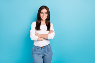 Sticker - Photo of cute good mood female businesswoman with crossed arms successful lady isolated on blue color background