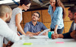 © T Hinrichsen/peopleimages.com - Making tomorrows success today. Shot of a group of coworkers having a meeting in an open plan office.