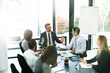 © Thurstan Hinrichsen/peopleimages.com - Working through the meeting agenda like pros. Shot of a team of executives having a formal meeting in a boardroom.