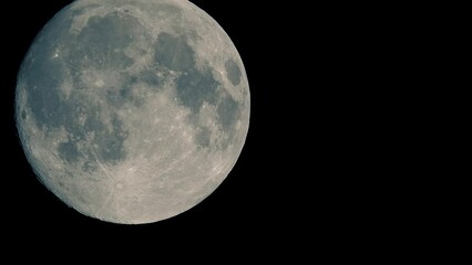 Wall Mural - Full moon moves fast at night sky. Sharp footage of full moon with telephoto lens close-up. Moon shot from ground. Moon witchcraft magic ritual concept.