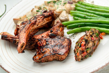 lamb rack barbecue served with side dishes