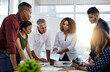 © Delmaine Donson/peopleimages.com - They see a challenge, creatives see opportunity. Shot of creative employees working in a modern office.