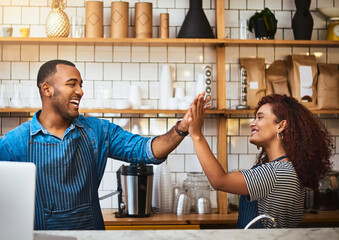 Poster - Theres nothing they cant do together. Cropped shot of an affectionate young couple high fiving while standing in their coffee shop.