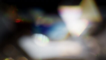 Reflections and colors of a blurred shiny crystal