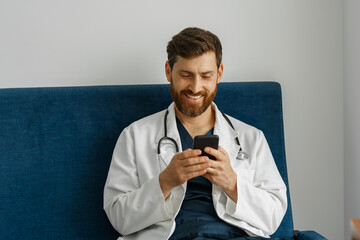 Wall Mural - Doctor therapist use phone during break in medicine office