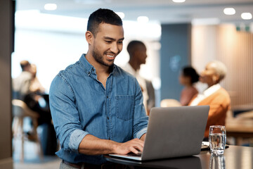 Poster - A keen mind is hard to find. Shot of a young businessman using a laptop at a conference.