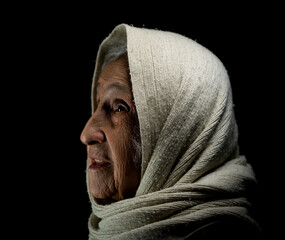 Wall Mural - Elderly woman with kerchief, studio portrait. High quality photo