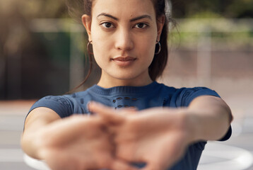 Canvas Print - Sports helps to develop mental and physical toughness. Portrait of a sporty young woman stretching her arms on a sports court.