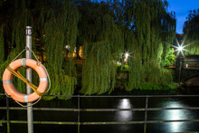 View Of River Lee In The Evening In Cork City, Ireland. Orange Lifebuoy Attached To The Railings