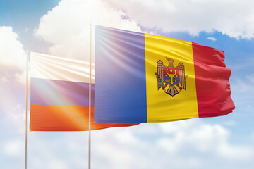 Wall Mural - Sunny blue sky and flags of moldova and russia