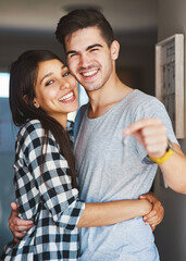 Poster - We couldnt be happier. Portrait of a happy young couple standing in the door of their new home.
