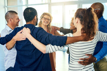 Aufkleber - Friendship is like a circle. Shot of a group cheerful friends holding each other while standing in a circle inside of a building.