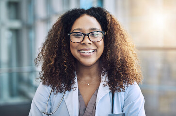 Aufkleber - I know from experience that happiness is the best medicine. Portrait of a female doctor standing in a hospital.