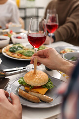 People having brunch together at table indoors, closeup