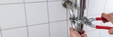 Fototapeta Kawa jest smaczna - Plumber Repairing Sink With Adjustable Wrench