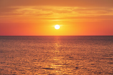 Bright sunset under the sea surface