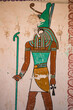hieroglyph wall painting of horus egyptian god in valley of the kings, luxor egypt holding ankh