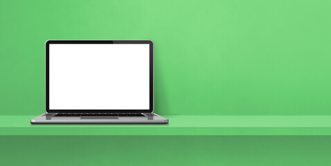 Laptop computer on green shelf background banner