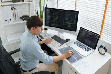 Wall Mural - software development concept, male programmer pointing on data code to checking website programming