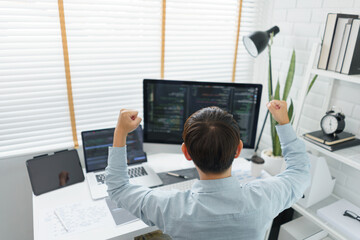 Wall Mural - software development concept, male programmer excited and raise arms after successful programming