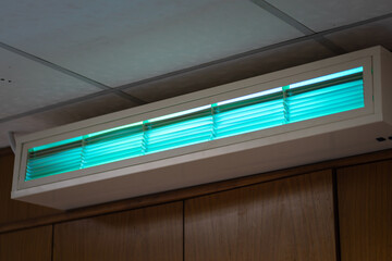 An UV lighting lamp using to cleaning and sterilizing bacteria in the air. Electrical equipment object photo.