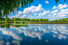 Tsaritsynsky Park In Moscow On A Sunny Summer Day. View Of The River With Reflection And Bridge. Tsaritsynsky Park Is One Of The Main Tourist Attractions In Moscow.
