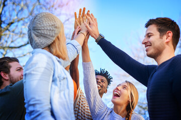 Poster - Yes we all aced the exam. Cropped shot of university students standing outside with their hands together.