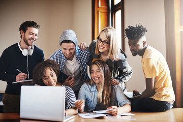Poster - Bringing our ideas together for a better assignment. Cropped shot of a group of university students working on an assignment together in class.