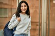 © Krakenimages.com - Young middle east student girl smiling happy standing at the city.