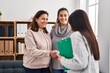 © Krakenimages.com - Three woman patient and psychologist shake hands at psychology center