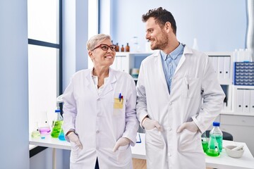 Sticker - Mother and son scientist partners standing at laboratory