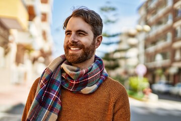 Wall Mural - Young caucasian man with beard outdoors on a sunny day