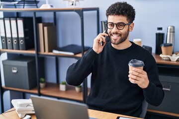 Sticker - Young arab man business worker talking on the smartphone working at office