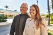 © Krakenimages.com - Middle age man and woman couple smiling confident standing together at park