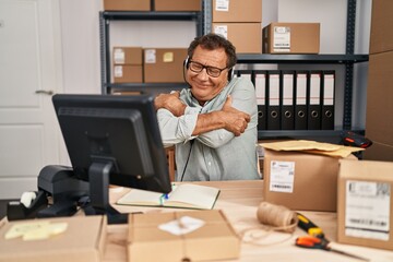 Sticker - Senior man working at small business ecommerce wearing headset hugging oneself happy and positive, smiling confident. self love and self care