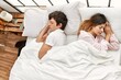 © Krakenimages.com - Young caucasian couple sleeping lying on the bed at home.