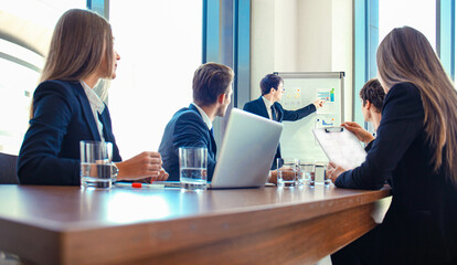 Wall Mural - business conference presentation with team training flipchart office