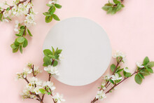Round Podium With Flowering Apple Branches For Product Presentation. Abstract Minimal Geometrical Form On Pink Background. One Showcase, White Flowers, Soft Shadow. Scene, Display. Top View, Flat Lay