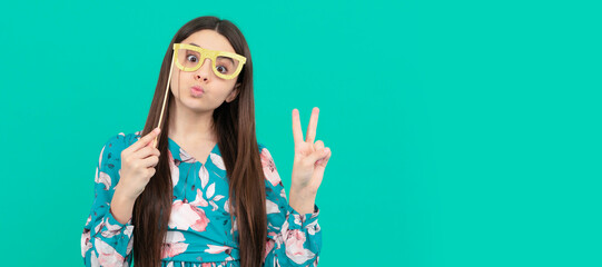 stay cool. cool girl hold booth glasses showing victory hand. enjoying disguise party. funny teenage