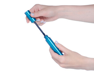 Sticker - Hand holding mascara in blue tube on white background isolation