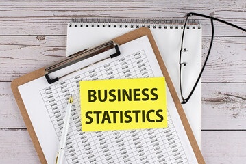 Wall Mural - Text BUSINESS STATISTICS text on a sticky on keyboard, business concept