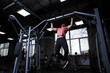 © mad_production - Low angle shot of a sportsman doing pull-ups at the gym