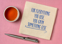For Everything You Lose, You Gain Something Else - Inspirational Reminder Note, Handwriting On A Napkin With A Cup Of Tea, Optimism, Positivity And Personal Development Concept