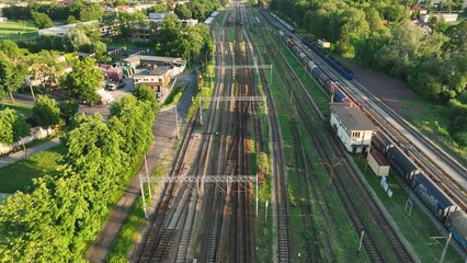 Canvas Print - the view from the drone on the railroad tracks against the background of the setting sun. concept of