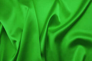 Wall Mural - Green satin fabric as background