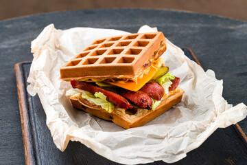 Canvas Print - Waffle waffles with grilled sausages and fresh vegetables