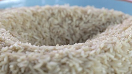 Canvas Print - Scooping Brown Rice from Bowl