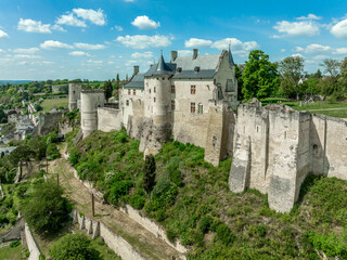 Wall Mural - Aerial view of the royal lodgings in the middle castle of Chinon with adjoining curtain walls restored recently with blue cloudy summer sky