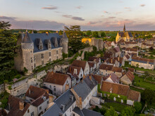Aerial Sunset View Of Montresor Medieval Castle With A Renaissance Mansion In Indre Et Loire, On A Rocky Overhand Dominating The Valley, On Of The Most Beautiful Villages Of France